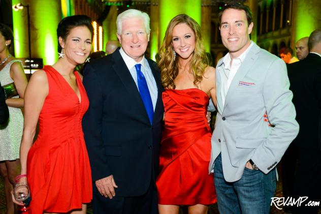 Congressman Jim Moran stands flanked at the National Building Museum by Fashion for Paws fundraising models Hollis Pica, Dr. Katy Nelson, and Scott Thuman.